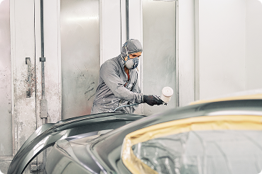 a man painting a car
