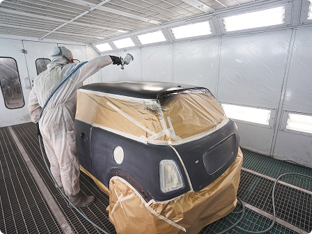 a car being painted in a garage